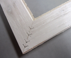 The linen liner arms are attached using wedge nails to form a frame