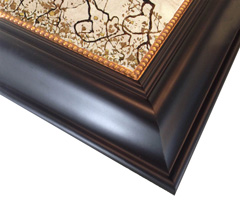 This wide black frame is decorated with a slender gold fillet.