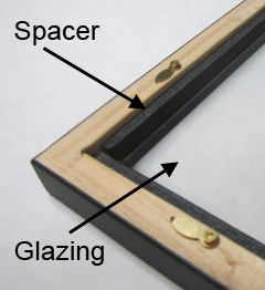  A small frame with custom spacers attached after the glazing is placed