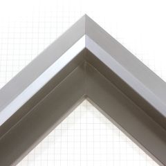 Unique geometric 1 " floater. The face of this molding features an off center peak which gives it a unique contrast in the right lighting.  This frame comes in Metallic Blue Pewter with a dull satin finish.