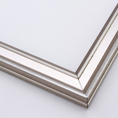 This narrow frame features a crown moulding profile finished in silver leaf.  An antique look is achieved with a gentle brushed effect that highlights the corners of the bevelled edges.

1.25 " width: ideal for small- to medium-size images.  Border a black-dominant grayscale photograph or acrylic painting with this stylishly simple frame.